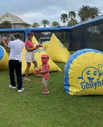 Family enjoying gellyball at our inflatable setup
